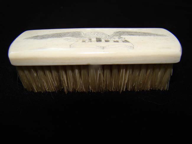 A late 19th century Whalebone brush with scrimshaw eagle and shield — image 2